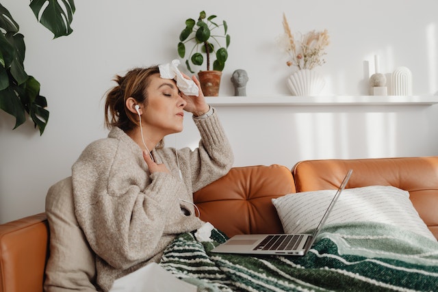 lady having fever on sofa